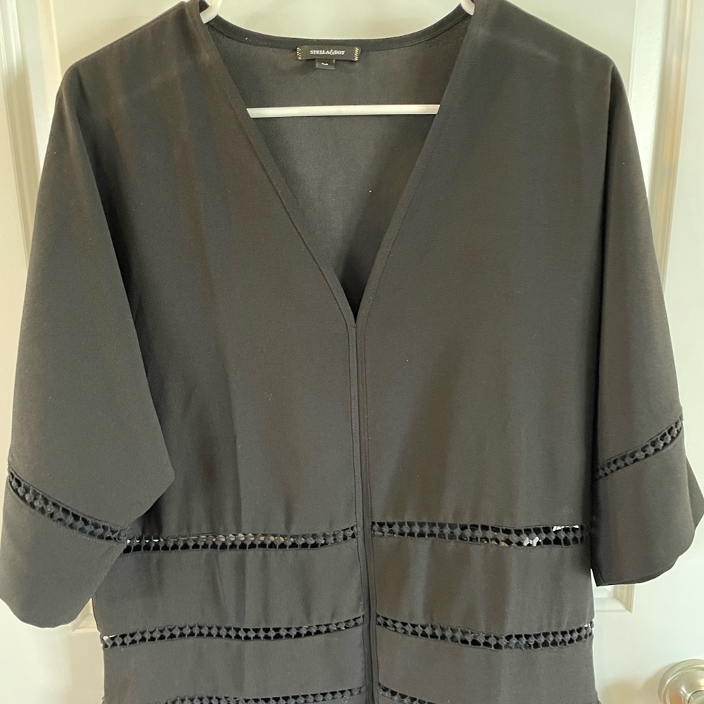 Stella & Dot size medium black summer top with eyelet cutouts.